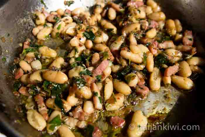 Pasta sauce with beans, pancetta and herbs