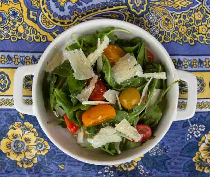 Arugula and cherry tomato salad with shavings of parmesan