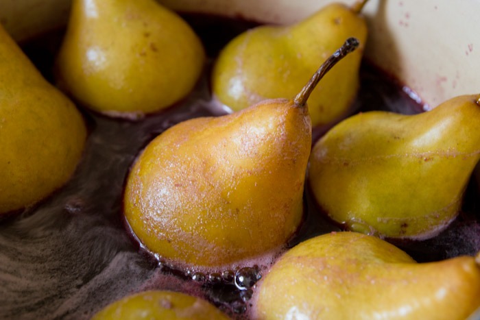 pears cooking in red wine