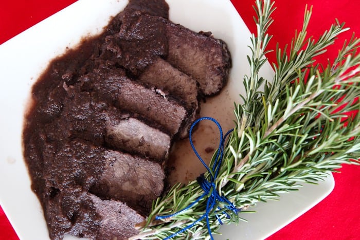 sliced Italian pot roast in Barolo sauce